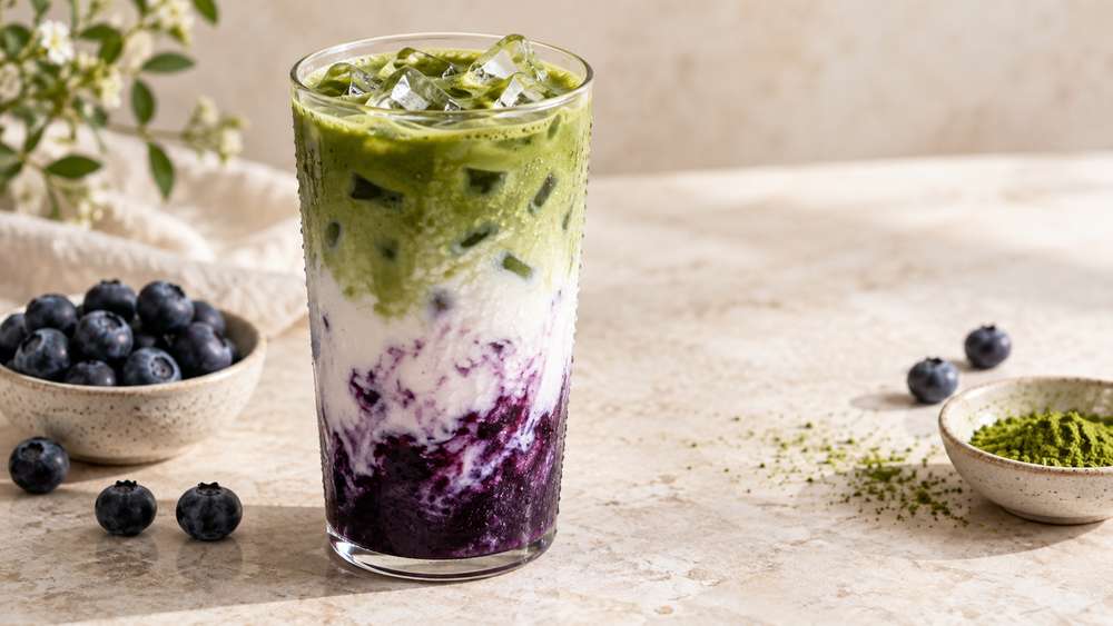 Layered blueberry matcha latte with fresh blueberries and first-harvest matcha