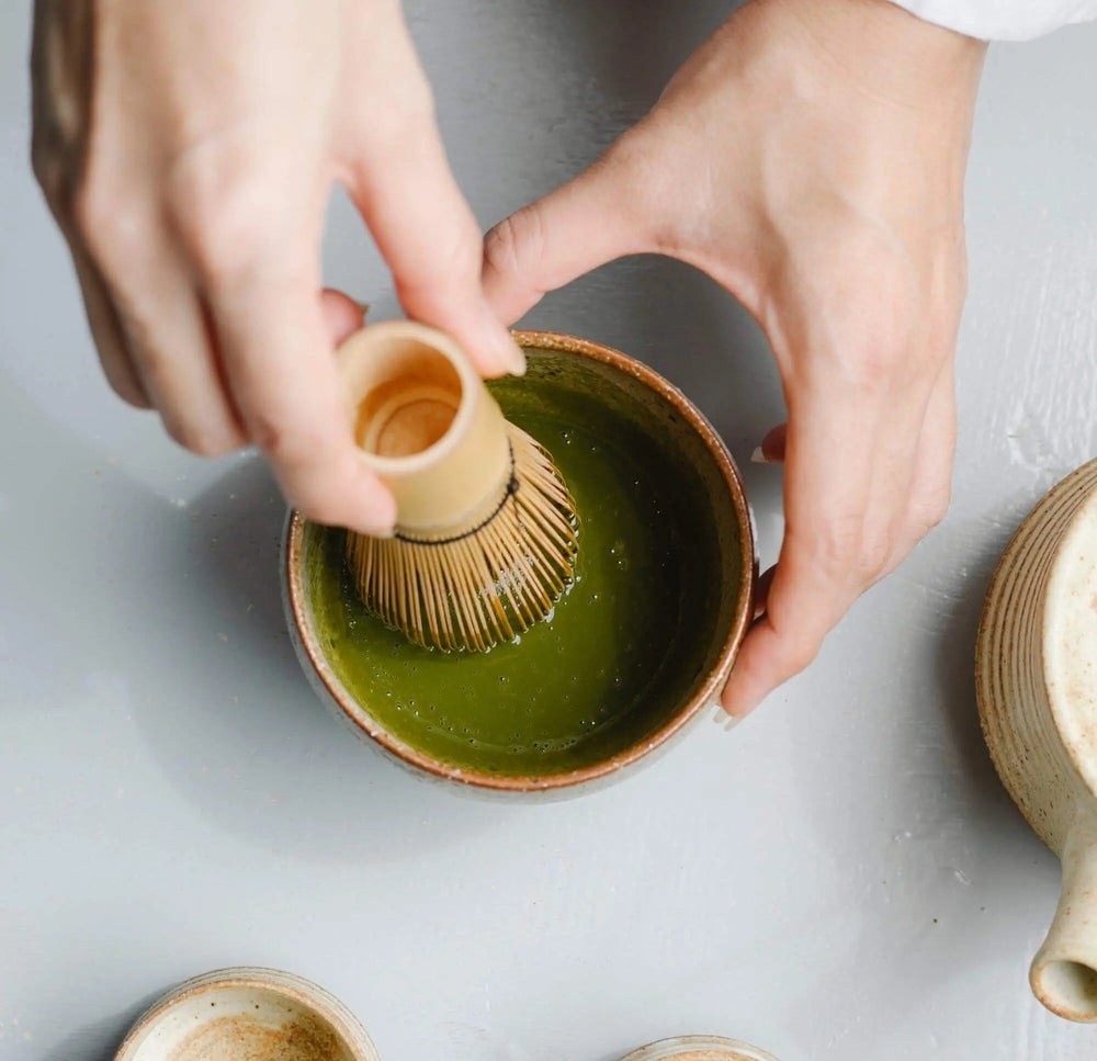Beginner using a bamboo chasen to whisk matcha smoothly