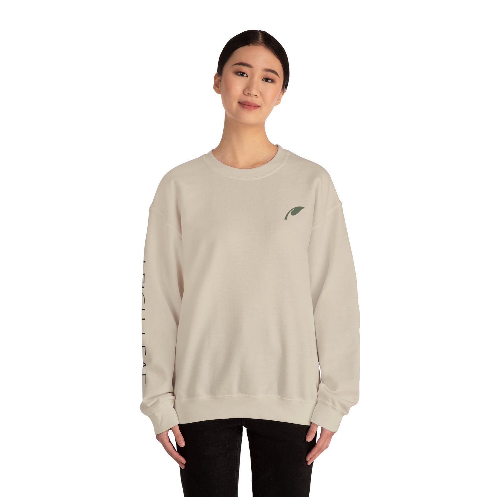 Model wearing Leigh Leaf Unisex Crewneck Sweatshirt in beige, exuding comfort and style, a cozy sweatshirt for matcha lovers.