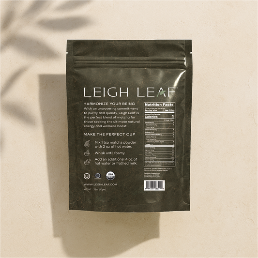 Pouring a vibrant green tea made from Leigh Leaf's Premium Organic Ceremonial Grade Matcha - 50g Bag, highlighting its traditional preparation and exquisite taste.
